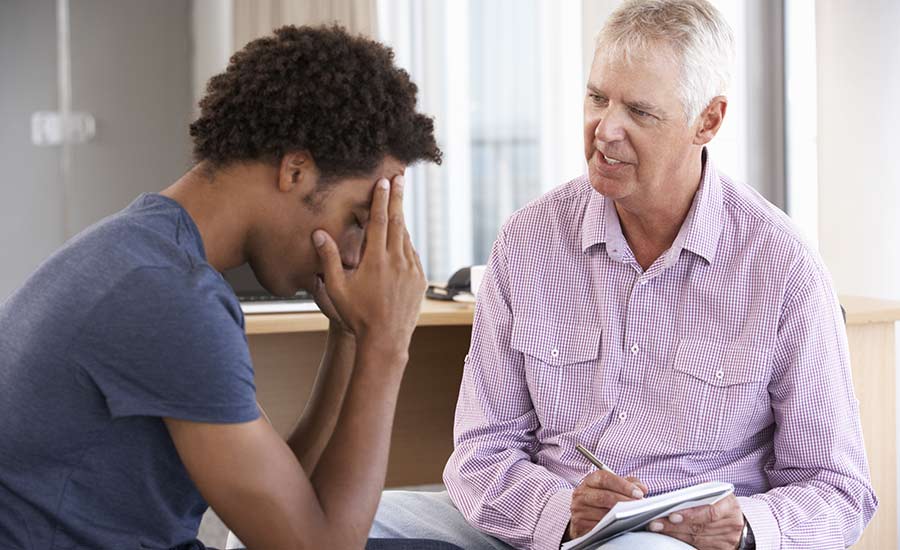 A young man having a counselling session​