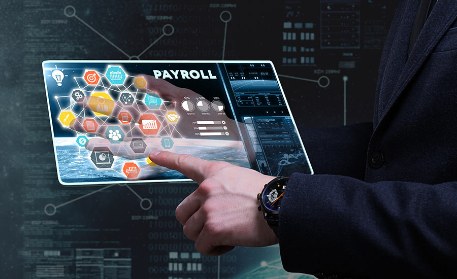 The hands of a man holding a tablet saying Payroll​