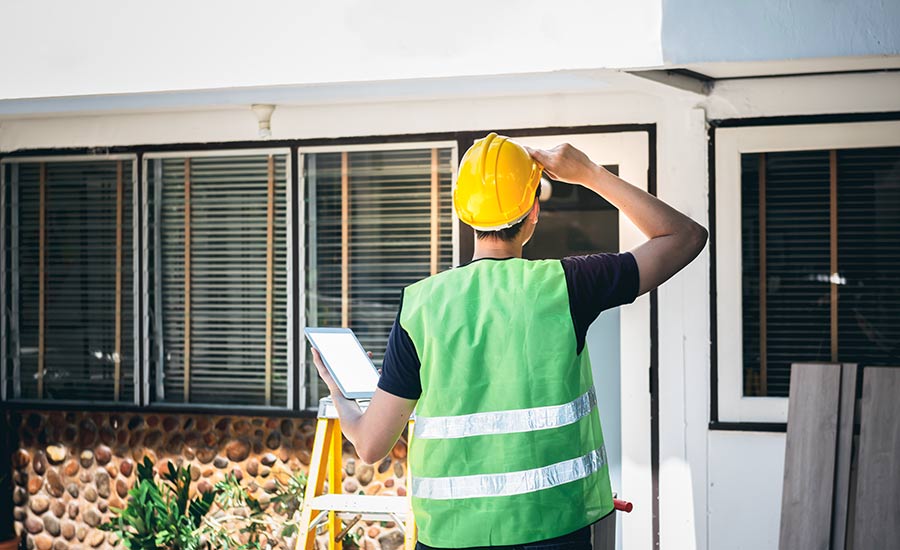 A home inspector with a tablet​